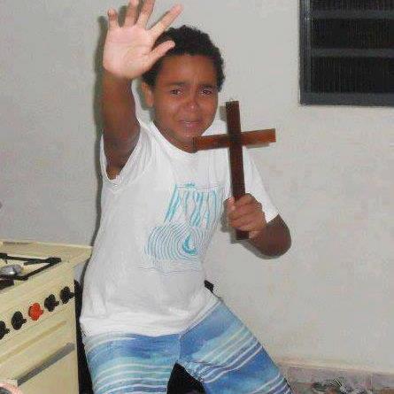 Image result for boy holding up cross meme